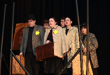 Actors wear Stars of David on stage during performance of "From the Fires" at CMS.