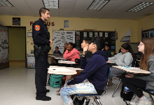 Officer Levy speaks with sixth-grade class.