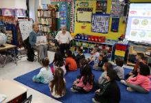 Granny Suzie and Jo read "And Then It's Spring" by Julie Fogliano to Donna Sandak's kindergarten class