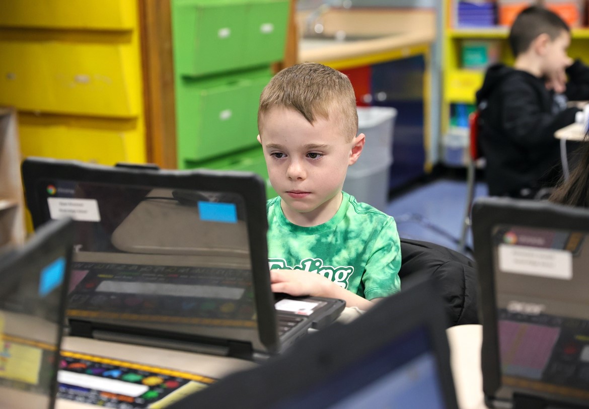 North Ridge second grader works on laptop computer.