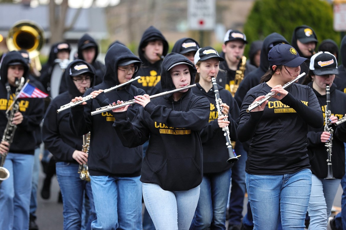 CHS flute player marches in Commack Little League North Opening Day parade.