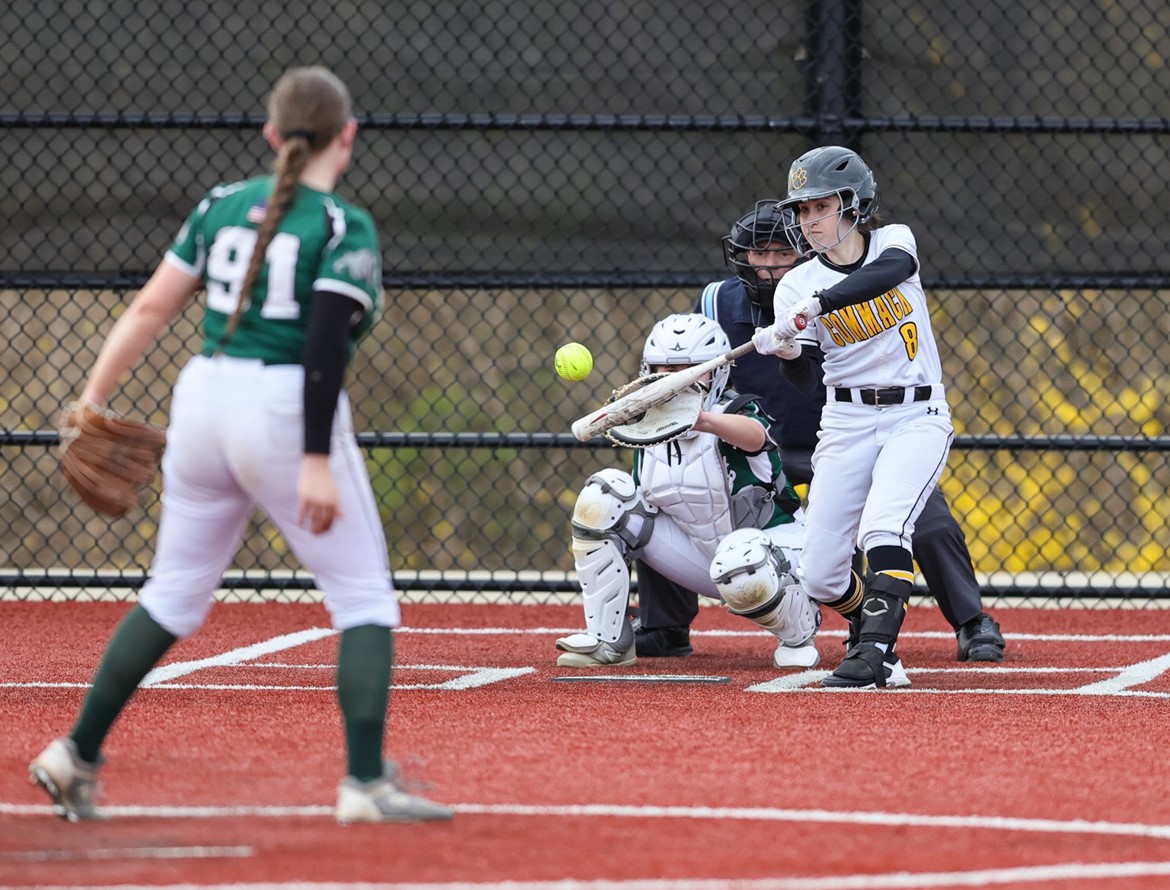 CHS softball player swings at pitch from Lindenhurst pitcher.