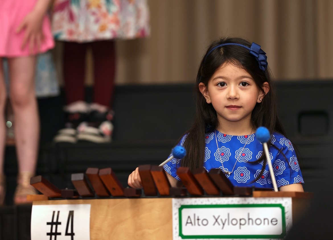 Indian Hills Primary first grader plays xylophone during performance.